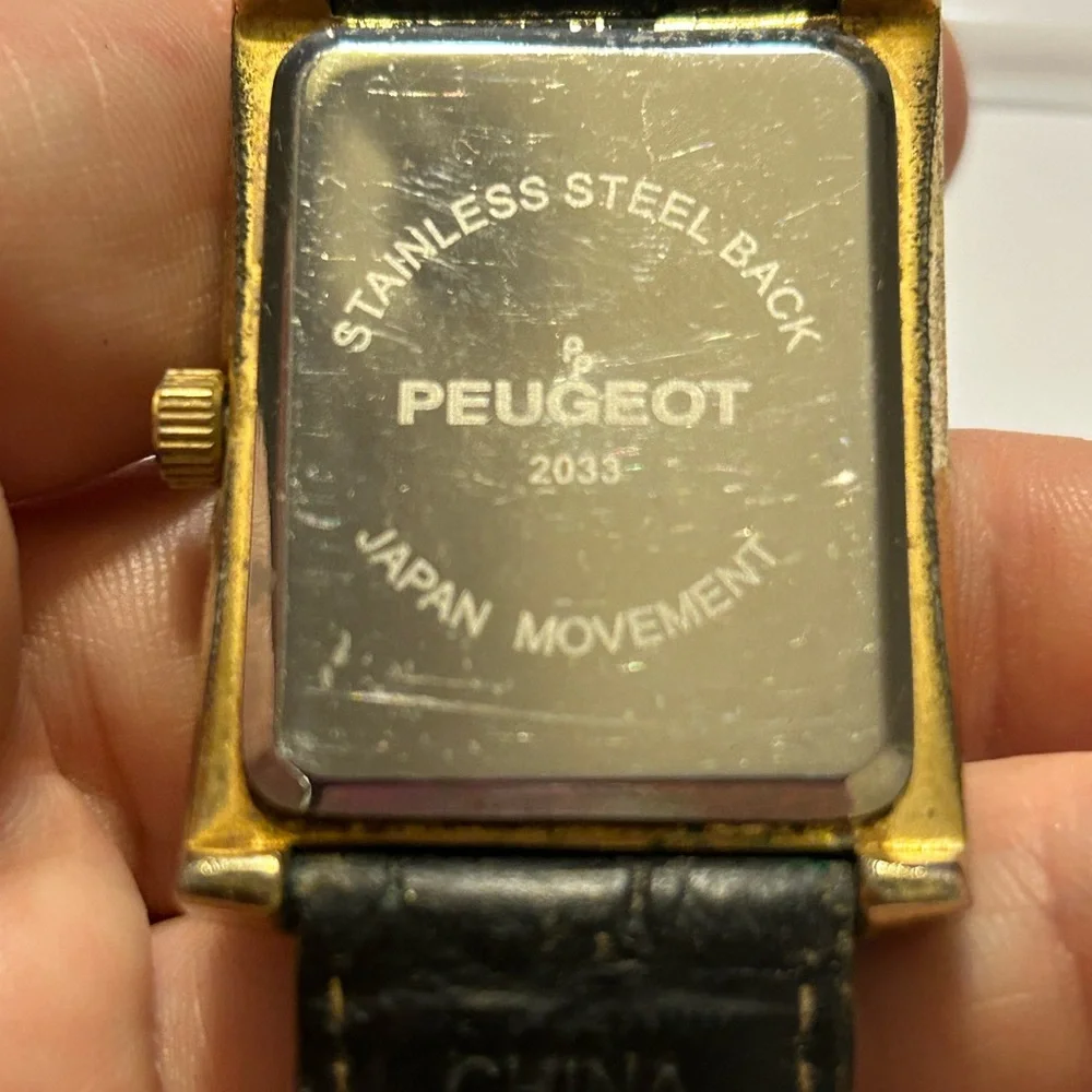 Peugeot Gold and Black Timepiece